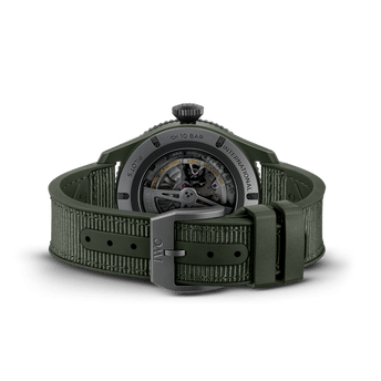 Back shot image of IWC Pilot’s Watch Timezoner TOP GUN Woodland with ceramic case and green rubber strap with textile inlay.