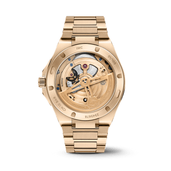 Back shot of IWC Ingenieur Tourbillon 41 with gold case and gold bracelet.