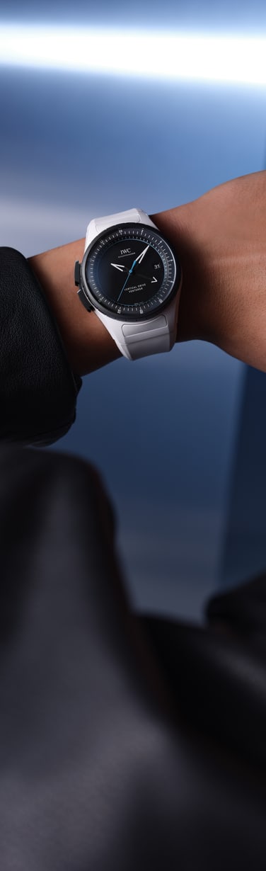 Close up of IWC Pilot’s Venturer Vertical Drive with black dial, and white strap.