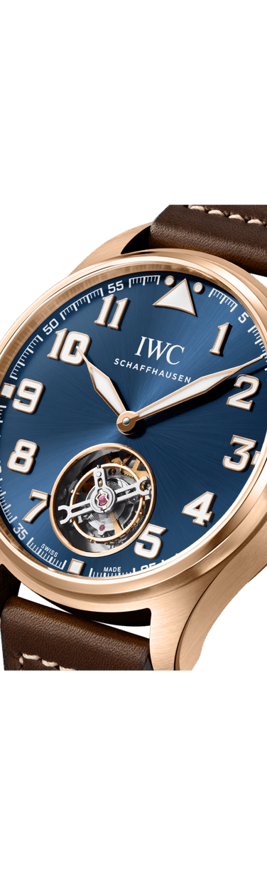 Close up image of IWC Big Pilot’s Watch 43 Tourbillon Le Petit Prince with blue dial, 18 ct Armor Gold® case and brown calfskin strap.