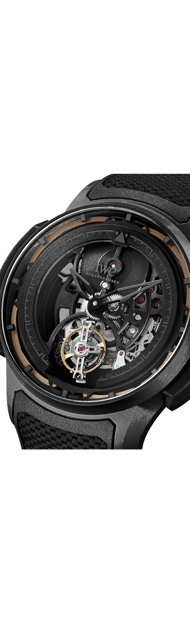 Close up image of IWC Big Pilot’s Watch Shock Absorber Tourbillon Skeleton XPL with black dial, Ceratanium® case and black rubber strap with black calfskin inlay.