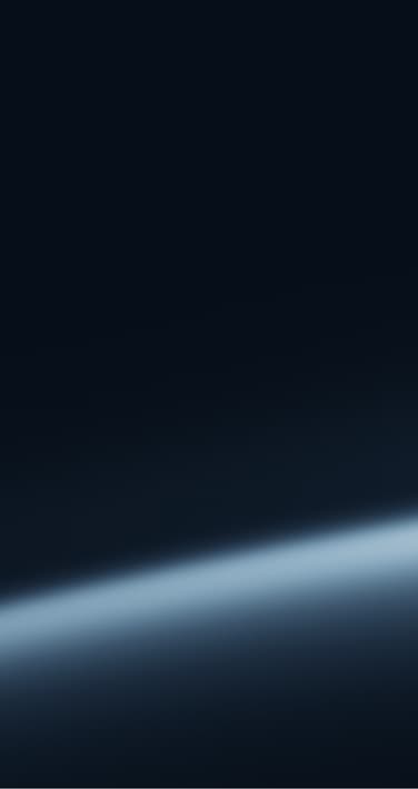 View of Earth from space showing the curvature of the planet with a glowing blue atmospheric horizon against a dark sky