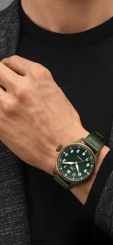 Bronze watch with green dial and leather strap