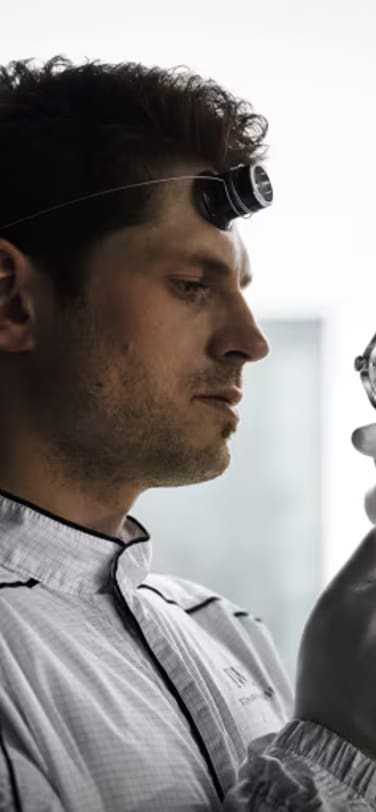 Watchmaker holding a watch