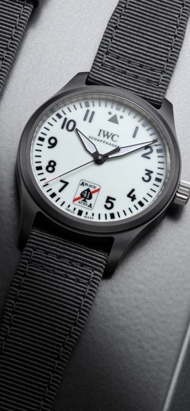 Two Pilot’s Watches with black cases and straps and white luminescent dial