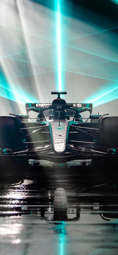 Front view of Formula 1 race car with blue light beams above it