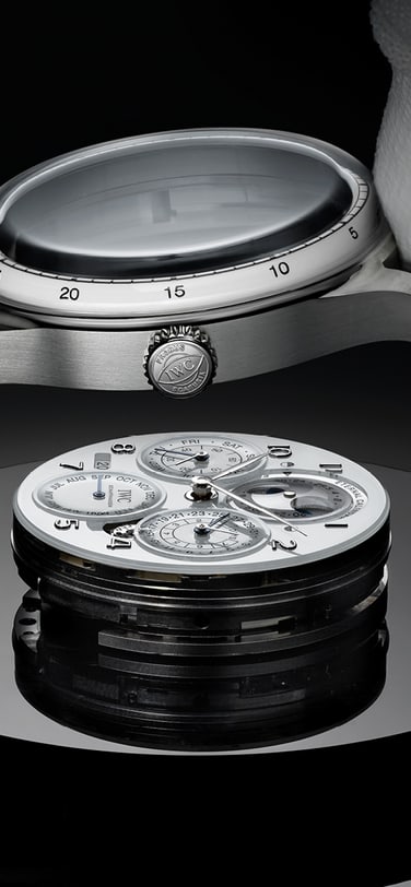 two fingers wearing white gloves putting glass dome on IWC Portugieser Eternal Calendar dial