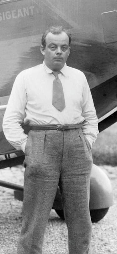 Antoine de Saint-Exupéry standing in front of an airplane, "L'Intransigeant."