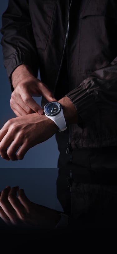 Pilot’s Venturer Vertical Drive on the wrist of a man; a space-certified mechanical watch with a white case and strap, and a black bezel.