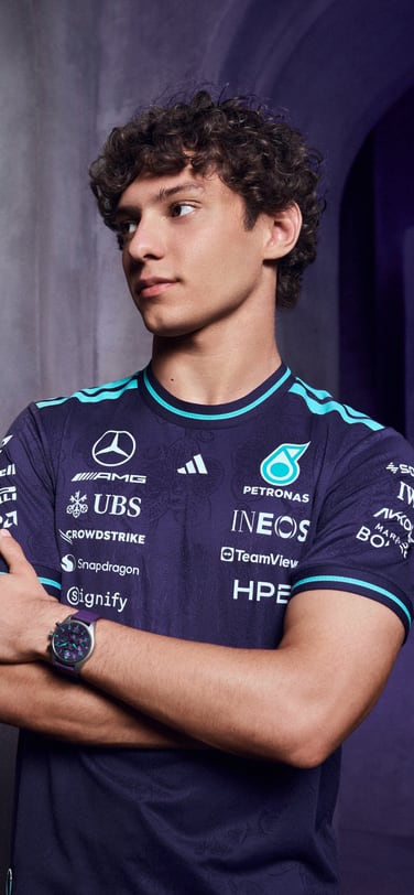Kimi Antonelli wearing Petronas Team shirt and modelling Pilot's Watch Chronograph 41 Mercedes-AMG Petronas Formula One™ Team