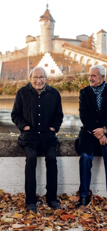 IWC legendary watchmakers Kurt Klaus and Amaro Abad sitting at the area of Schaffhausen Munot
