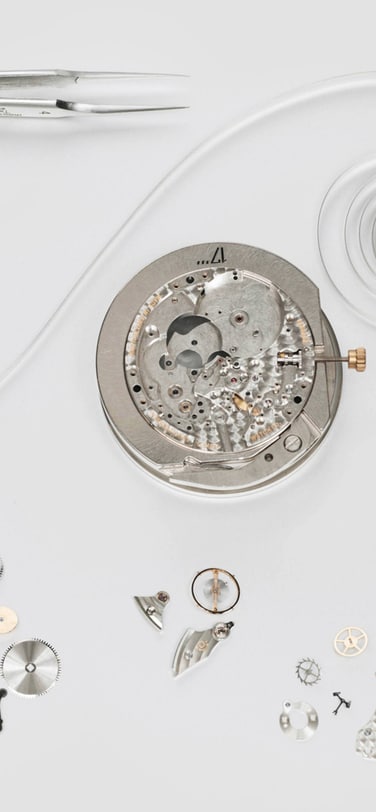 The disassembled parts of an IWC watch