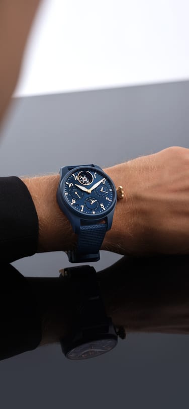 IWC Pilot's Watch Le Petit Prince with blue dial, blue ceramic case and rubber strap on a man's wrist
