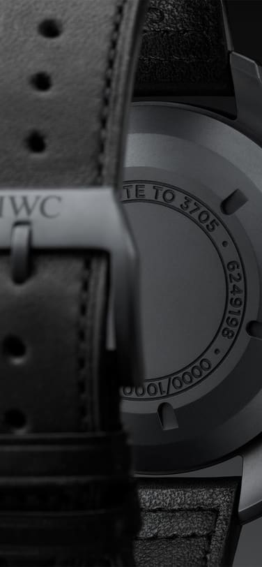 Backshot of the Pilot’s Watch Chronograph Edition “Tribute to 3705” displaying the Black case and strap