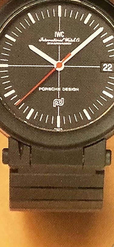 Two IWC Porsche-Design compass watches with black dials and black straps