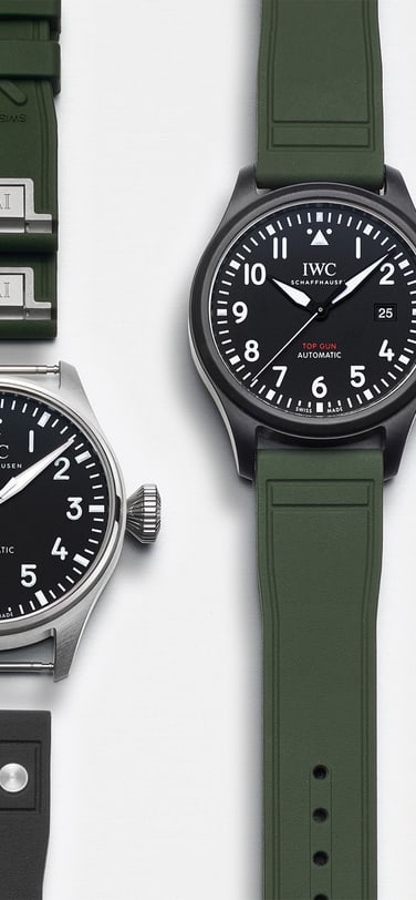A selection of IWC watches from the front with green rubber straps.