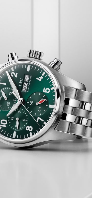 Front image of a green dial watch with a steel metal bracelet.