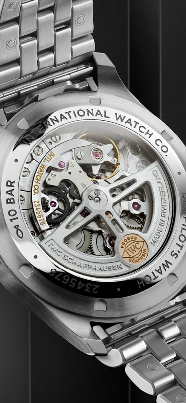 IWC watch with detailed circular graining surrounds the movement and the transparent sapphire case back.