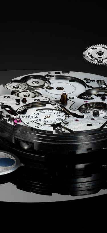 Portugieser Eternal Calendar watch dial unassembled on a black surface