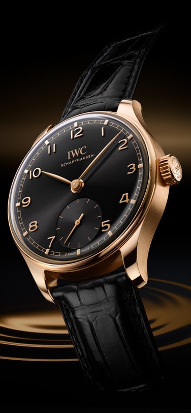 High-Angle image showcasing the Portugieser Automatic 40 Obsidian Watch with black leather strap, bronze case and black dial