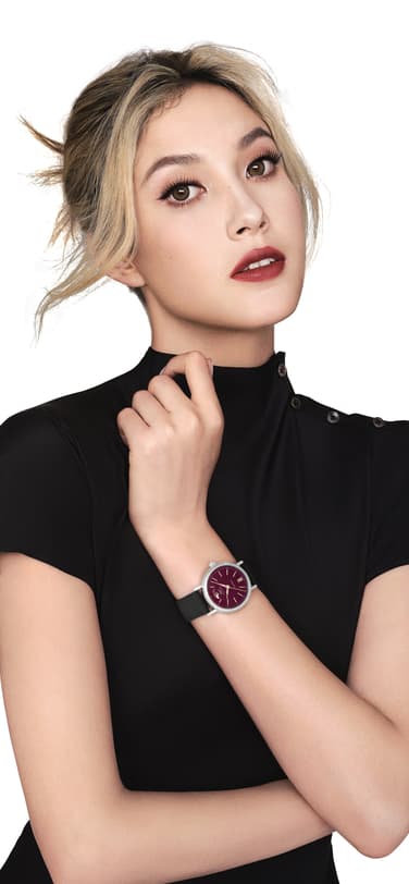 Freestyle skier and IWC brand ambassador Eileen Gu in black dress sporting the IW459604 Portofino Automatic Moon Phase 37 Year of the Snake.