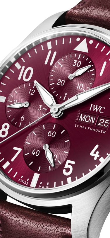 Pilot’s Watch Chronograph Edition “Chinese New Year” watch with burgundy dial and strap against white background