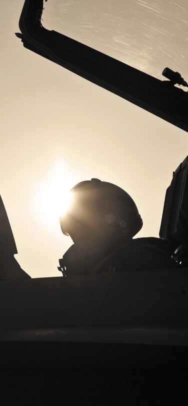 Sillhouette of a TOP GUN pilot in a Jet plane