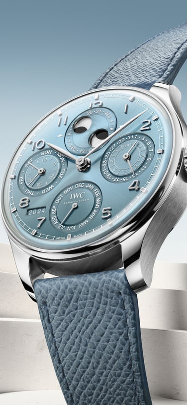 High-Angle image showcasing the Portugieser Perpetual Calendar 44 Horizon Blue Watch with blue strap, titanium case and blue dial