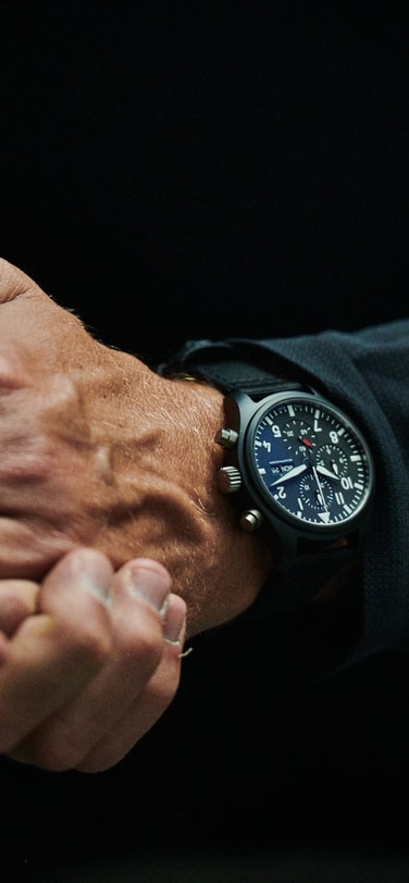 Close up of a man's wrist wearing an IWC watch