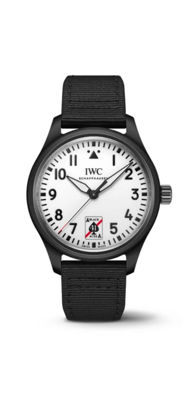 Pilot's Watch Automatic 41 Black Aces laying on a dark surface, black dial, black fabric strap and white dial with black lettering