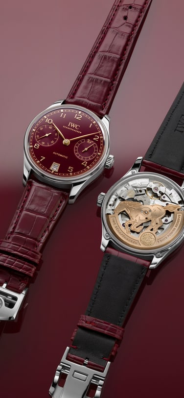 Close up on hands putting black dial of IWC Portugieser Perpetual Calendar on its mechanism