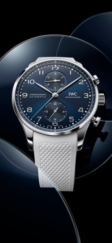 Close up on hands putting black dial of IWC Portugieser Perpetual Calendar on its mechanism
