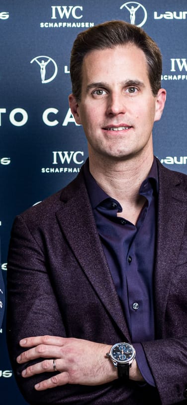 IWC CEO Chris Grainger-Herr next to one of the Academy members