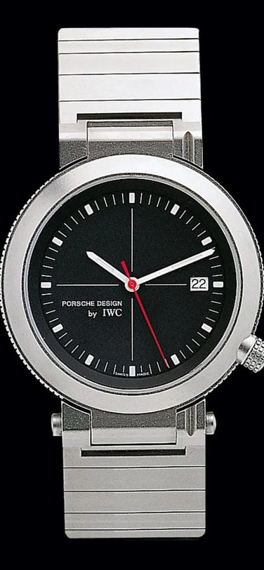 The IWC-Porsche Design compass watch with black dial and silver strap