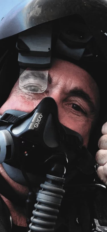 Former Captain US Navy Captain Jim di Matteo in flight mode wearing an IWC TOP GUN watch