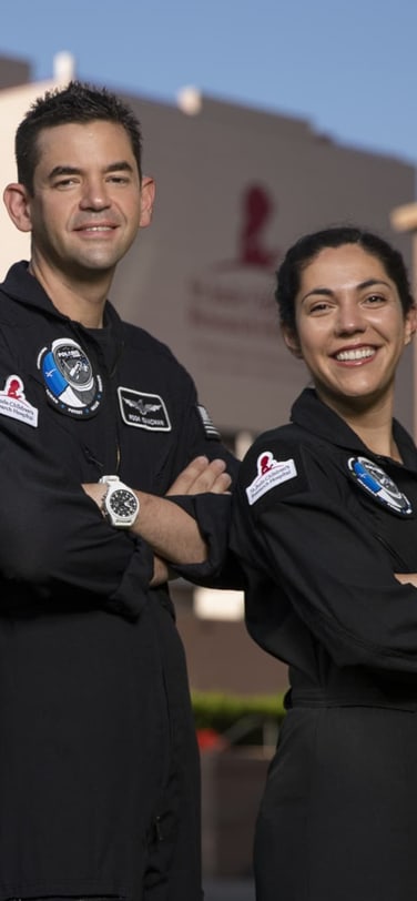 The Polaris Dawn crew outside of St. Jude's Children's Research Hospital wearing white IWC Watches