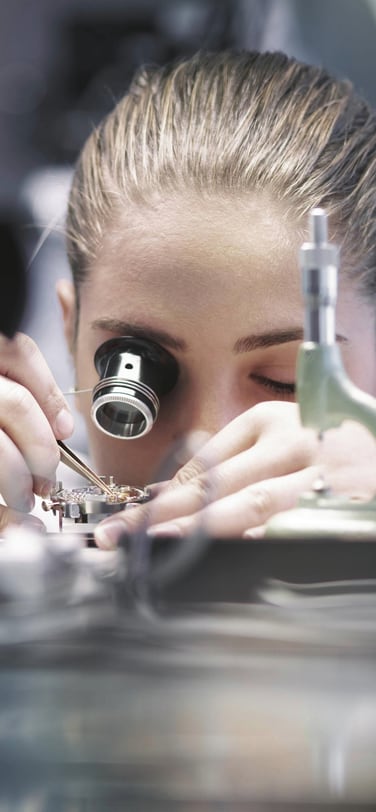 An IWC watchmaker at work