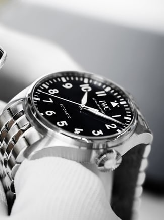 Thumbnail image link showing a watch being carefully examined with the aid of a Loupe monocle