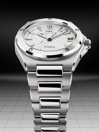 Wristshot of woman in black jacket wearing the IWC Ingenieur Automatic 35 with silver plated dial, stainless steel case and bracelet.