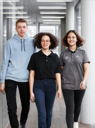 Three young people walking on a corridor