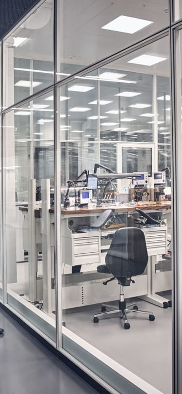 Two watchmakers strolling through a watchmaking manufacture