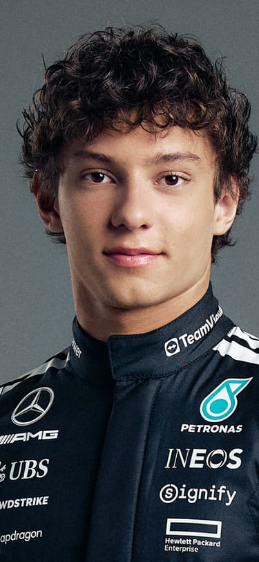 F1 Driver in black racing suit wearing a Mark XX with Petronas green strap