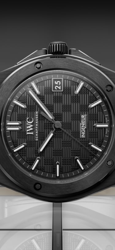 IWC watch with a black dial on a green background