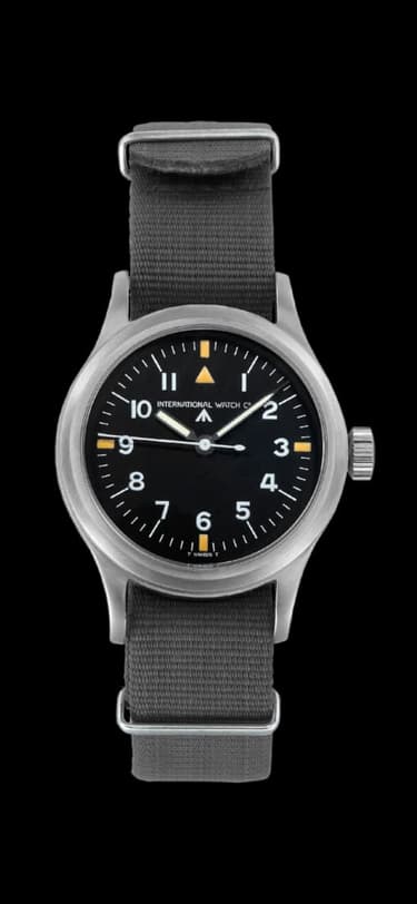 The IWC Mark 11 watch with black dial and grey textile strap