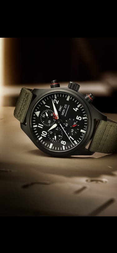 IWC IW389104 Pilot’s Watch Chronograph Top Gun Edition “SFTI” with ceramic case, black dial and green textile strap on surface