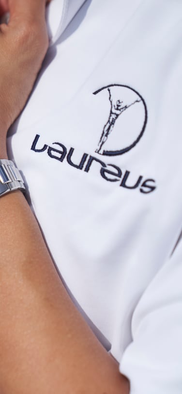 Laureus sport for good participants signing a t-shirt.