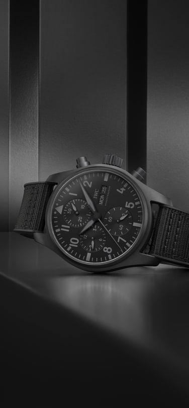 Pilot's watch chronograph 41 Top Gun Ceratanium IW388106 in the forground in front of dark background