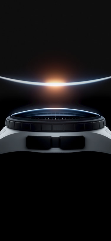 A space-certified mechanical watch with a white case and strap, and a black bezel and pushers beneath a luminous arc resembling a sunrise over Earth, set against a dark background.