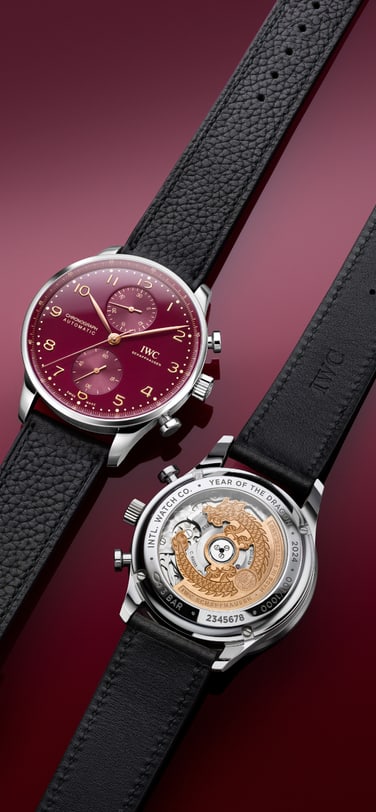 A front and back image of IWC Portugieser Chronograph Year of the Dragon watch (Ref. IW371629) with burgundy dial and black leather straps.