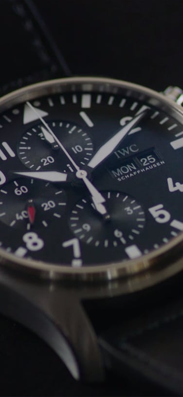 Close up of IWC watch with blue dial and stainless steel case